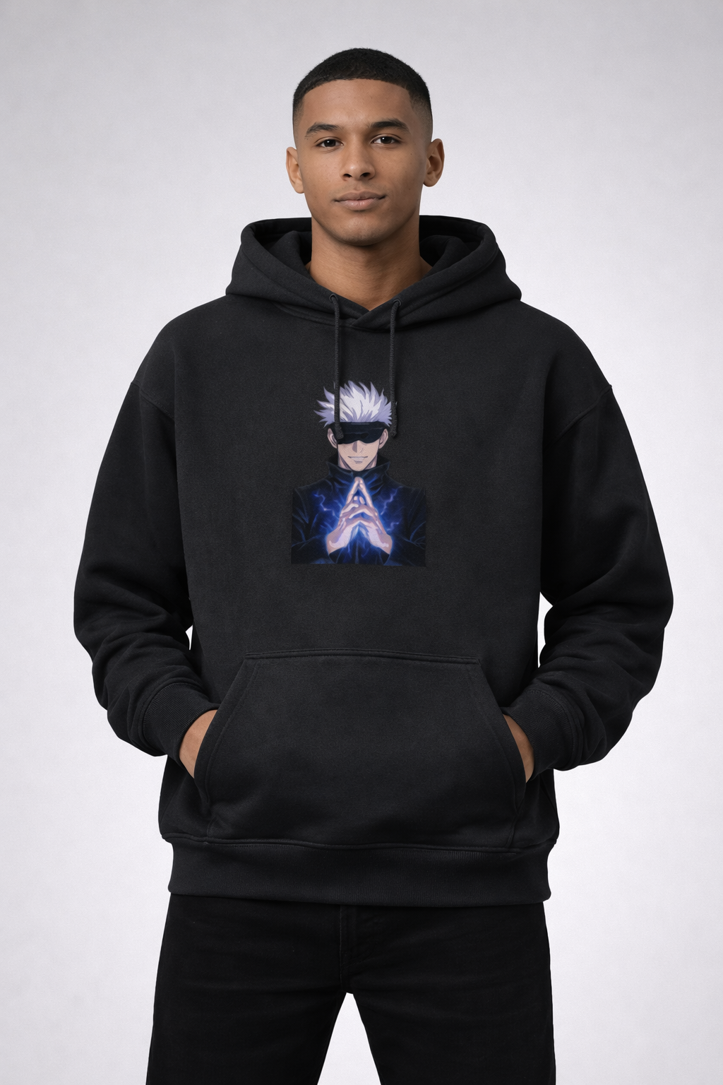 Person wearing a black hoodie with a graphic design on a white background